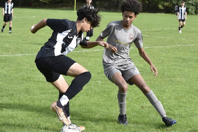Action from Peterborough Lions Under 15s (stripes) v Northside. Photo: David Lowndes.