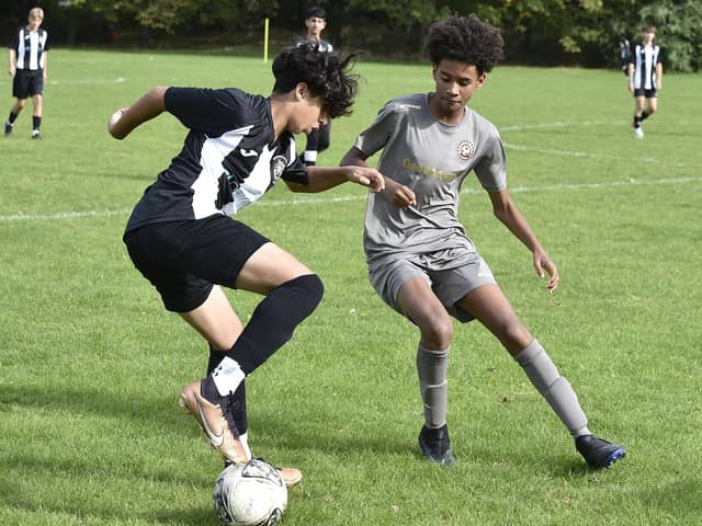 Action from Peterborough Lions Under 15s (stripes) v Northside. Photo: David Lowndes.
