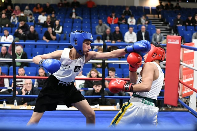 Home club fighter  Mohammed Ismaael (blue) v Nikolas Mirga at a Peterborough Police Boxing Tournament at Queen Katharine Academy.