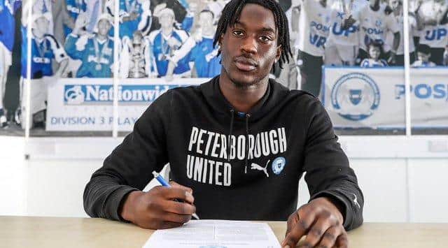 Joel Odel-Larbi signs his short-term professional contract at Posh. Photo Joe Dent/theposh.com.