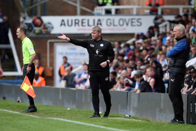 Peterborough United manager Grant McCann alongside Blackpool manager Neil Critchley on the touchline. Photo: Joe Dent/theposh.com