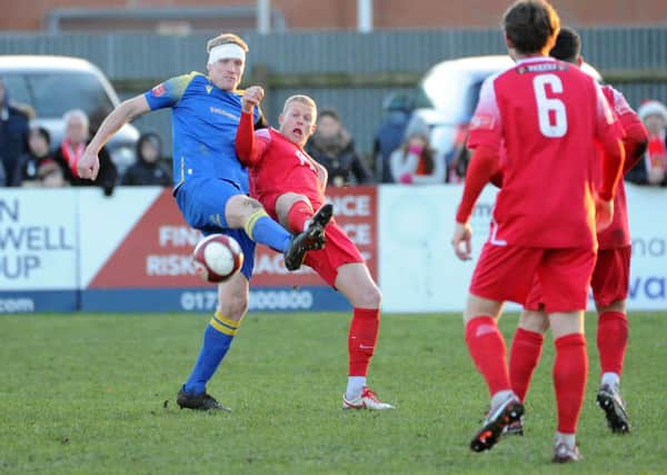 Spalding United's two-goal hero Nathan Stainfield (blue) in action against Stamford.