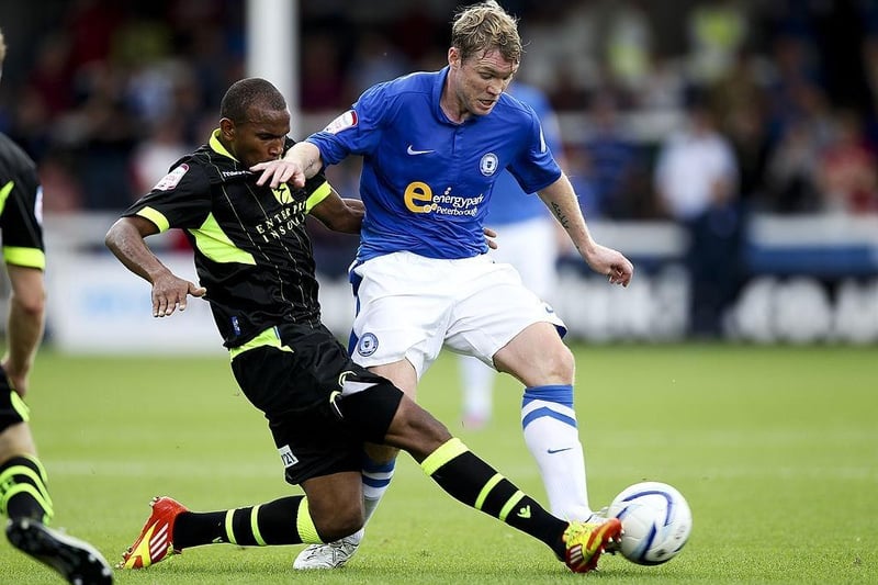 This picture shows Grant McCann battling away for Peterborough United in a match against Leeds United at The London Road Stadium on August 25, 2012. McCann played 160 times for Posh between 2010 and 2015.