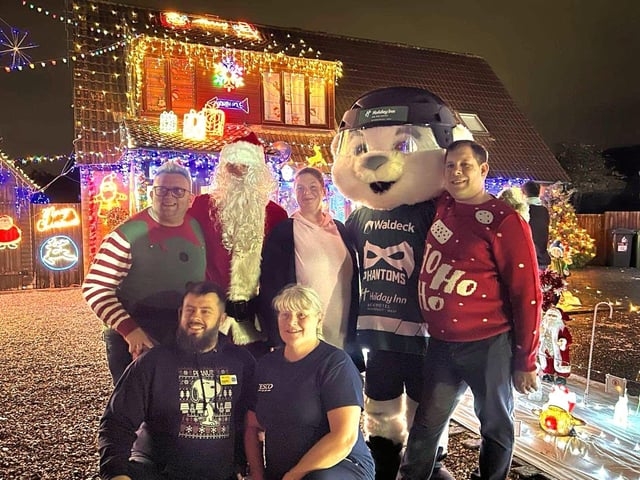 Group photo of the main supporters and guests. (Brian Bell, Santa, Cllr Kirsty Knight, PhamTom, Daryl Ward, Benjamin Penton (Sue Ryder) and Sharron Toms (Tesco Community Champion).