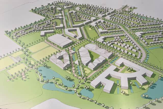 This image shows the proposed leisure village in foreground and housing behind it which is planned for the East of England Showground.