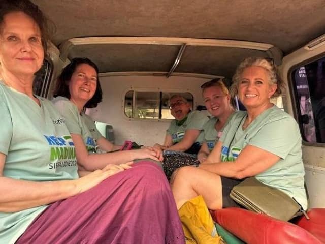 Lisa Kelly, pictured on the right, with the rest of the UK team out in Sierra Leone.