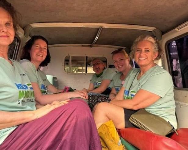 Lisa Kelly, pictured on the right, with the rest of the UK team out in Sierra Leone.