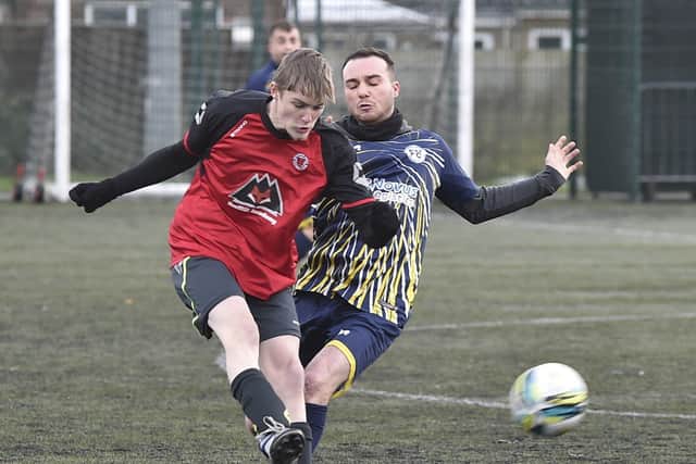 Action from Netherton Reserves (red) v Farcet. Photo: David Lowndes.