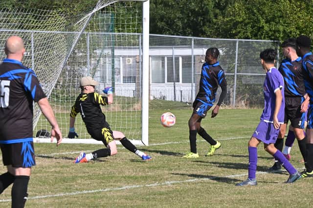 Sunday League action from Stanground Cardea Sports Development (purple) v Peterborough Saints. Photo David Lowndes.