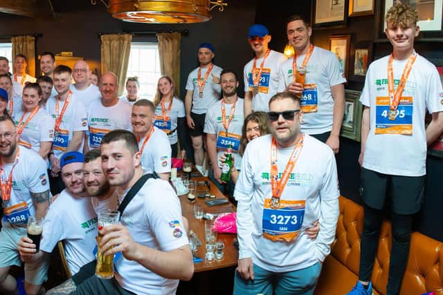 Runners from Peterborough-based Princebuild celebrate their fund-raising success