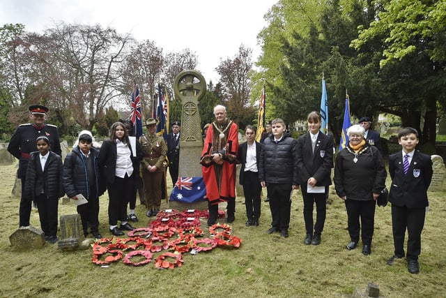 Royal British Legion Service of Remembrance on ANZAC Day at the grave of Sgt Hunter at Broadway - Standard bearers with Deputy Lrd Lt Chris Parkhouse and Mayor of Peterborough Nick Sandford and pupils from Jack Hunt School