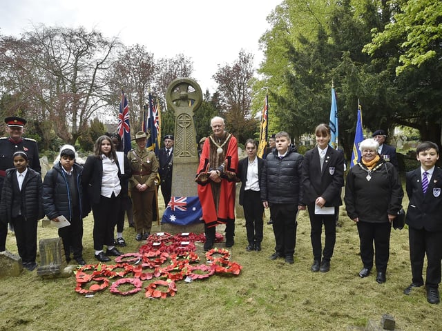 Royal British Legion Service of Remembrance on ANZAC Day at the grave of Sgt Hunter at Broadway - Standard bearers with Deputy Lrd Lt Chris Parkhouse and Mayor of Peterborough Nick Sandford and pupils from Jack Hunt School