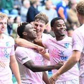Posh players congratulate Bolu Shofowoke for his part in Harry Leonard's goal at Leicester City. Photo David Lowndes.