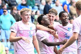 Posh players congratulate Bolu Shofowoke for his part in Harry Leonard's goal at Leicester City. Photo David Lowndes.