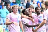 Posh players congratulate Bolu Shofowoke for his part in Harry Leonard's goal at Leicester City. Photo David Lowndes.