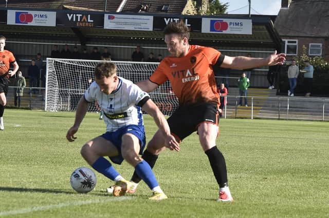 Peterborough Sports hope to have Matt Tootle (orange) back for the game against Tamworth. Photo: David Lowndes.