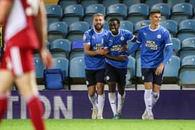 Kwame Poku of Peterborough United (middle) celebrates his goal against Accrington with Dan Butler (left) and Ronnie Edwards. Photo: Joe Dent/theposh.com