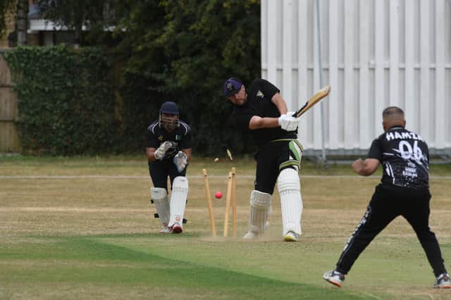 Newborough's Ashley Fisher is bowled during the Killingworth Cup Final against Sheikh 11. Photo: David Lowndes.