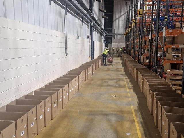 The boxes are lined up in the Yours Clothing warehouse ready for filling.