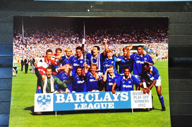 Steve Welsh is in the middle of the back row with his arms raised as Posh celebrate their success in the Third Division play-off final at Wembley in 1992.