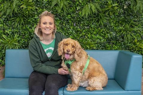Lizzie and Reggie by the "living wall" in the Welcome Centre
