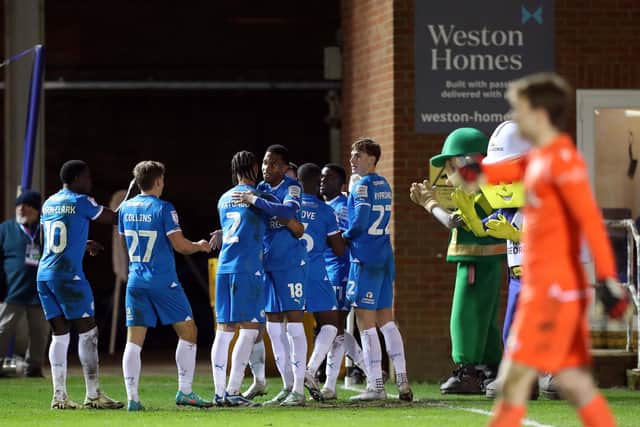 Peterborough United players celebrate the third goal against Stevenage. Photo: Joe Dent.
