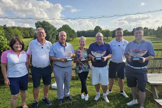 from the left, Nene Park's Tae Gooding (lady captain), Brian Robinson (seniors captain), Carson Steptoe, Ann Hawkins, Gary Geddis, Alan Young and Craig Shelton.