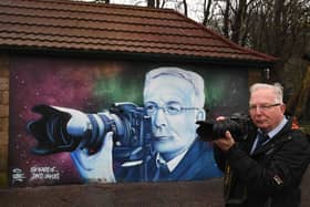 David recreates the shot that has been immortalised on the mural.