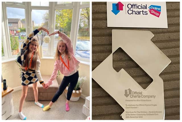 Ten-year-olds Abia Kisbee-Brown (L) and Darcy Gilbert were thrilled to receive their official awards for topping the singles chart with their charity song, ‘This One’s For The Children.’