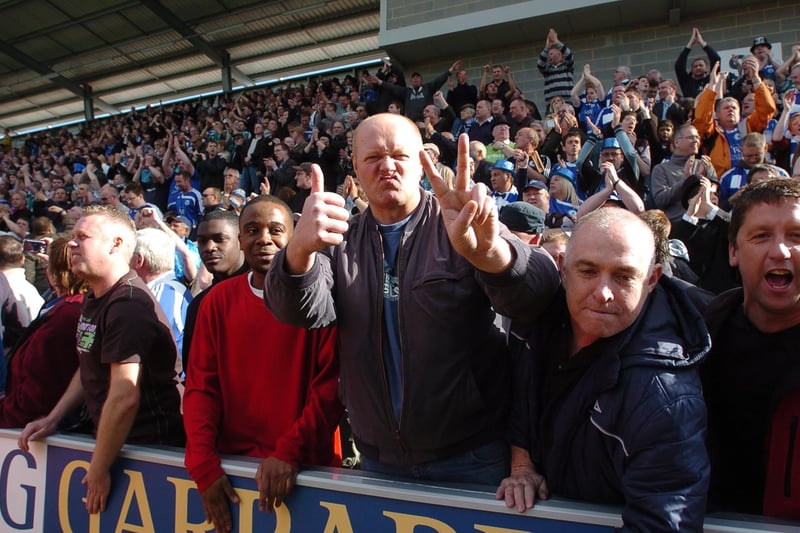 Peterborough united fans celebrate promotion to the Coca -Cola Championship following a 1-0 win over Colchester in the 2008/09 season.