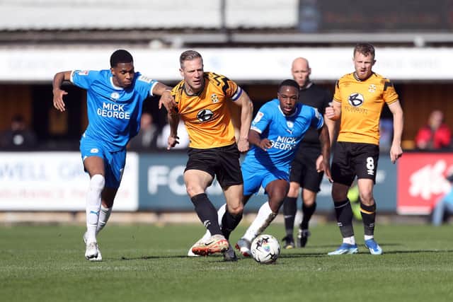 Malik Mothersille (left) and Jeando Fuchs in action for Posh at Cambridge. Photo Joe Dent/theposh.com