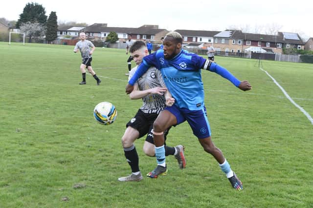 Action from AFC Malborne v Hampton United (blue). Photo: David Lowndes.