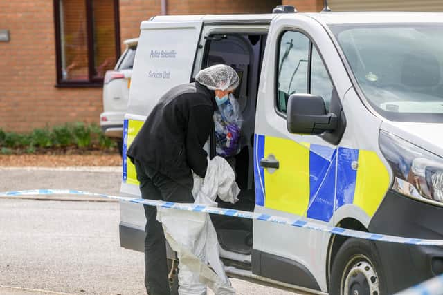 Police activity in The Row, in Sutton, Cambs, following a double shooting in the county.
