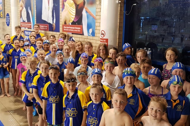 Members of Mansfield Swimming Club pose for a picture at Water Meadows.