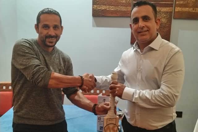 Asim Butt (left) with Barnack CC club captain Muhammad Yaseen.