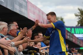Bart Cybulski celebrates with the Spalding United fans. Photo Ruby Pindar