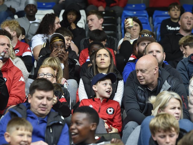 Peterborough United fans are pictured enjoying the win over Bristol Rovers.