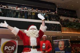 Father Christmas and Kev Lawrence switch on the Christmas lights at Queensgate.