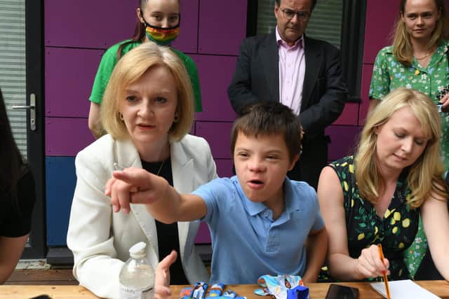 Foreign Secretary Liz Truss visits Little Miracles at Ravensthorpe. One of the children Ivo steals the show