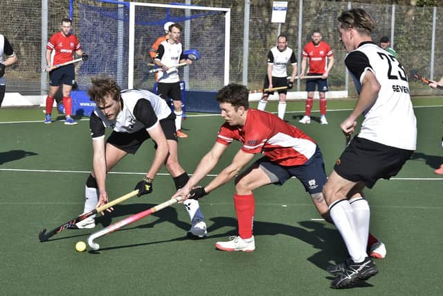 Action from City of Peterborough (red) v Harleston. Photo: David Lowndes.