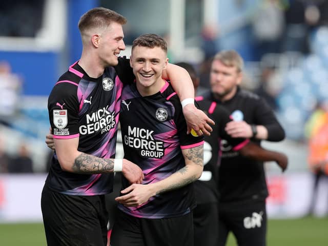 Josh Knight celebrated with Jack Taylor after Peterborough United's victory over Queen's Park Rangers at Loftus Road in the Championship.