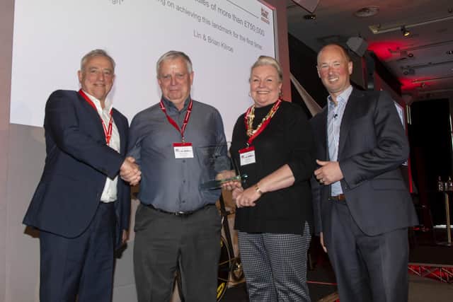 From left, Chris Chidley, Driver Hire’s chief executive, presents Brian and Lin Kilroe with their award with Jeremy Neale, Driver Hire’s UK managing director.