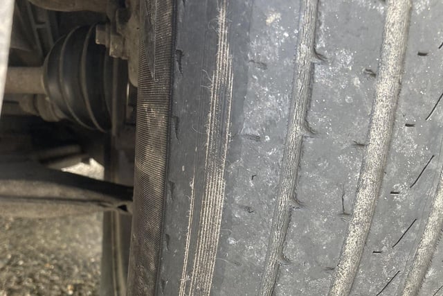 This vehicle was stopped by officers because its MOT had expired. An inspection of the vehicle revealed cord exposure on one tyre and another tyre which was under inflated with a slow puncture. Driver reported for several offences and directed to a nearby garage.