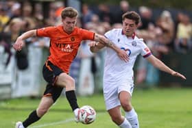 Action from Peterborough Sports (orange) at AFC Rushden & Diamonds. Photo Darren Wiles