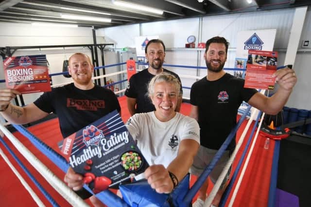Joe Osman, Adam Janocka and Marcello Renda with Sarah Huebler at the Boxing Futures Gym at Yaxley