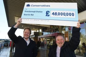 MP for Peterborough Paul Bristow and Council leader Wayne Fitzgerald with the Peterborough Station quarter regeneration cheque from the Government
