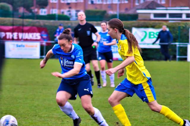 Kayleigh Aylmer (blue) in action for Posh Women v Sporting Khalsa. Photo: Dave Mears.