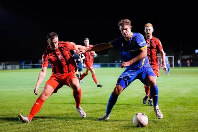 Mark Jones (blue) in action for Peterborough Sports against Redditch. Photo: James Richardson.