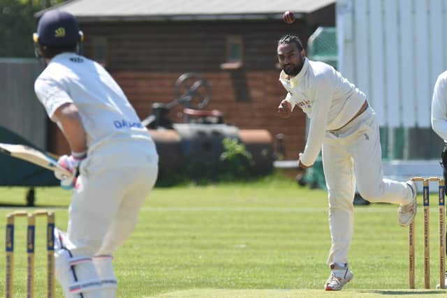 Prim Patel bowling for Oundle Town against Peterborough Town. Photo: David Lowndes.