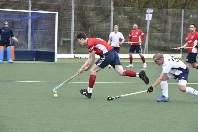 Matt Goodley (red) in action for City of Peterborough v Birmingham University. Photo: David Lowndes.
